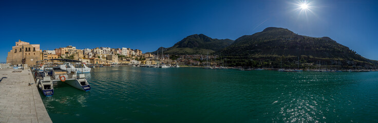 Fototapeta na wymiar Panoramic view of harbour with fishing boats on Castellammare de