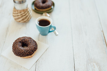 Breakfast in cafe with chocolate donut and coffee
