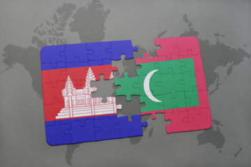 puzzle with the national flag of cambodia and maldives on a world map background.