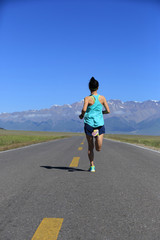 healthy lifestyle young fitness woman runner running on road