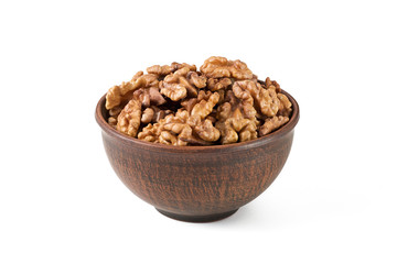 Walnuts shelled in a bowl isolated side view.