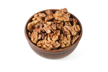 Walnuts shelled in a bowl isolated top view.