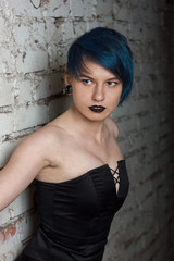 Fashion portrait of a beautiful woman with blue hair