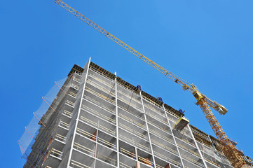 Crane and highrise construction site