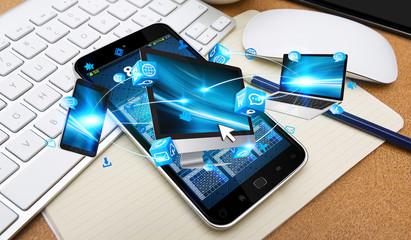 Tech devices connected to each other by mobile phone © sdecoret