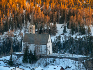 Small gothic church in Scuol village, Graubunden, Switzerland