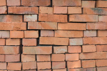 folded in a heap of old red bricks