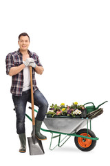 Gardener posing with gardening equipment