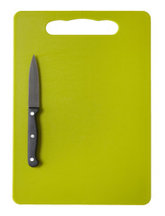 A green plastic chopping board with sharp knife isolated on a white background