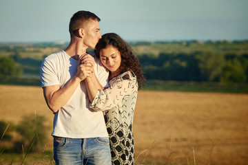 young couple portrait on country outdoor, love and tenderness concept, summer season