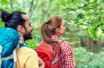 Fototapeta premium group of smiling friends with backpacks hiking