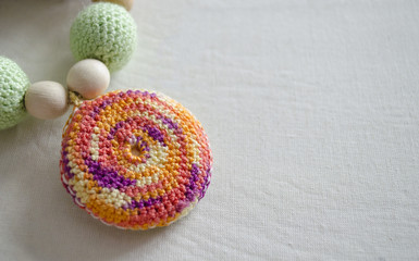 Necklace made from knitted beads and toys for the baby sitting in a sling. Knitted beads. Sling necklace