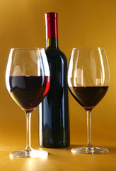 on the table a bottle of wine and a glass of