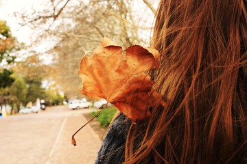 a leaflet stuck in a girl's hair
