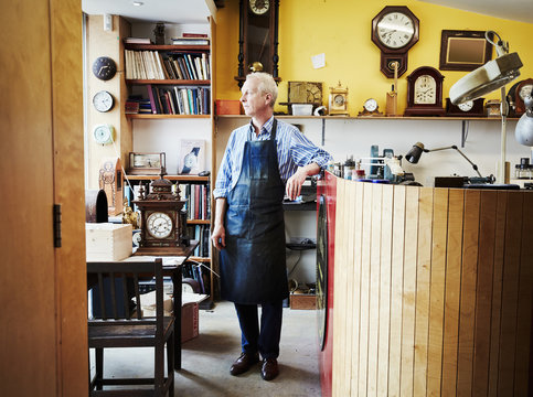 A clock maker in his workshop. 