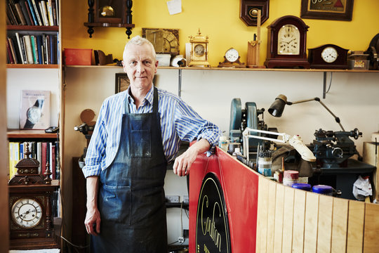 A clock maker in his workshop.