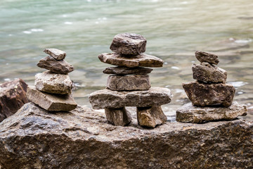 ALberta, Canada - Inukshuk rock piles by the lake