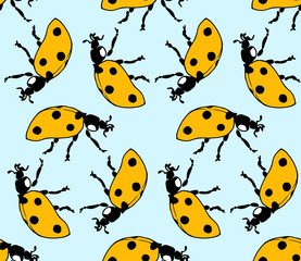 seamless pattern made from ladybugs on blue background