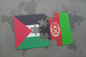 puzzle with the national flag of palestine and afghanistan on a world map background.