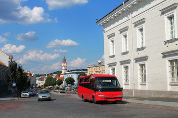 Fototapeta premium Red tourist bus in Old Town,Vilnius,L