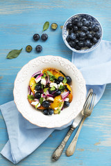 Summer salad with grilled peaches, blueberry and feta cheese