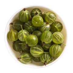 Bowl of gooseberries over white