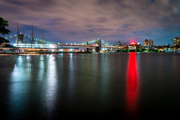 Naklejka premium Brooklyn Bridge and lower Manhattan at dusk viewed from the Brooklyn Bridge Park in New York City.