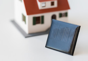 close up of house model and solar battery or cell