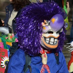 A colorful parade of carnival masks in the city of Riehen, Switzerland revives a centuries old...