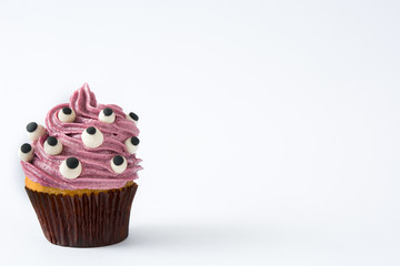 Halloween cupcake with eyes isolated on white background

