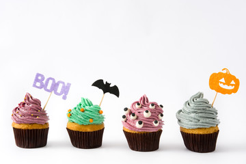 Variety of Halloween cupcakes isolated on white background

