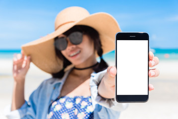 Beautiful woman's hand using smart phone at beach. Smartphone white screen. Asia woman hand holding using smartphone.