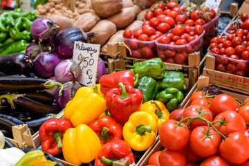 colored peppers, tomatoes, eggplant for sale at italian market