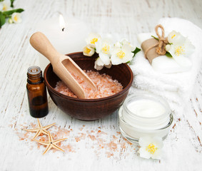 Spa concept with jasmine flowers on a old wooden background