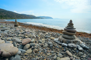Two of the pyramid from a sea pebble on the beach .