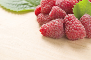 Juicy raspberry close up. Background of fresh summer berries with copy space.