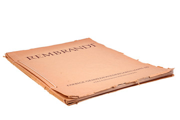 Old magazine with Rembrandts color reproductions isolated on white background