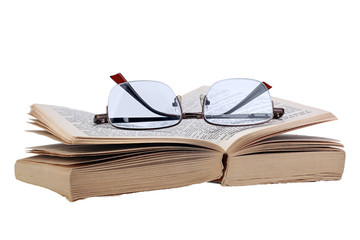 Open pocketbook and glasses isolated on white background