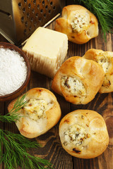 Baked buns stuffed with cheese and herbs
