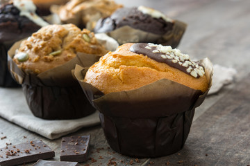 Chocolate muffins on a rustic wooden table

