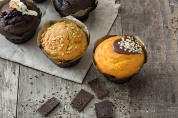 Chocolate muffins on a rustic wooden table

