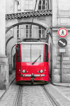 Red vintage tram on the street of old Prague