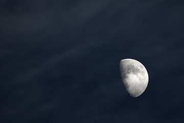 Half moon in the cloudy sky © Angelo D'Amico