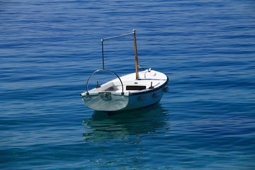 Small white boat in Brela , Croatia