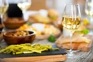 Wine, grape and cheese on wooden table
