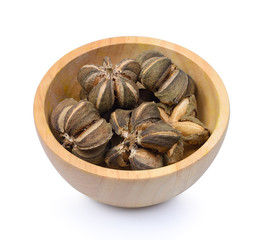 Sacha inchi peanut seed in wooden bowl on white background.