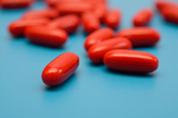 red pills on a blue background