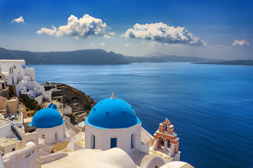 Greece. Cyclades Islands - Santorini (Thira). Oia town with typical Cycladic architecture - painted blue cupolas and white walls of houses. The Anastasis Church