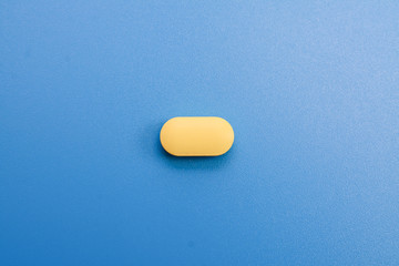 pills on a blue background