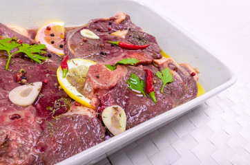 Steaks of red meat , marinated with emulsion of lemon juice and